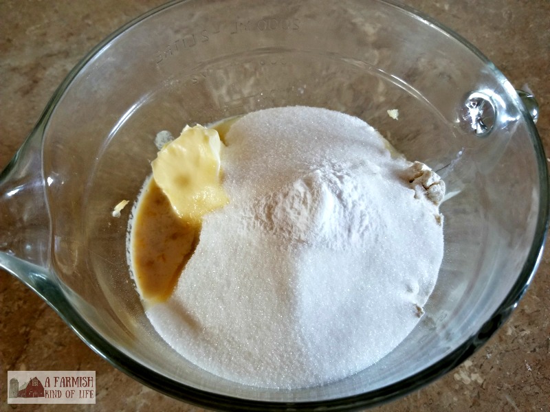 A bowl containing all the ingredients for quick bread, ready to mix.