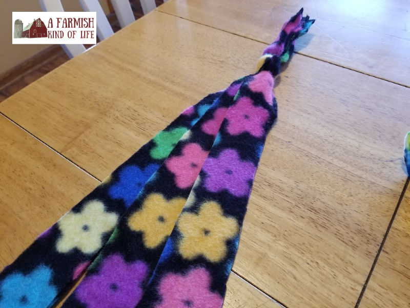 Let me share with you today how I make a homemade DIY dog toy using something I've got a lot of, and maybe you do, too: scrap fabric.